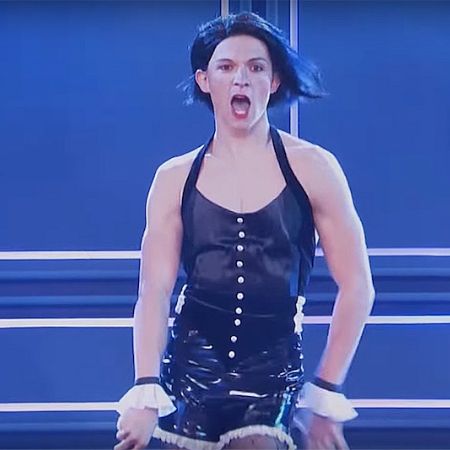 Tom Holland in a girl dress up while performing in the song "Umbrella".